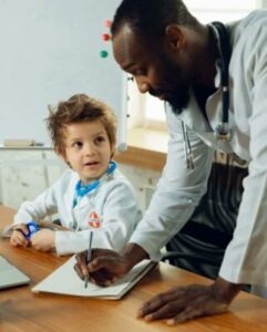 Kid working with older doctor