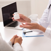 Prescription Medicine. Unrecognizable Female Doctor Prescribing Medication For Her Patient In Office. Cropped, Selective Focus