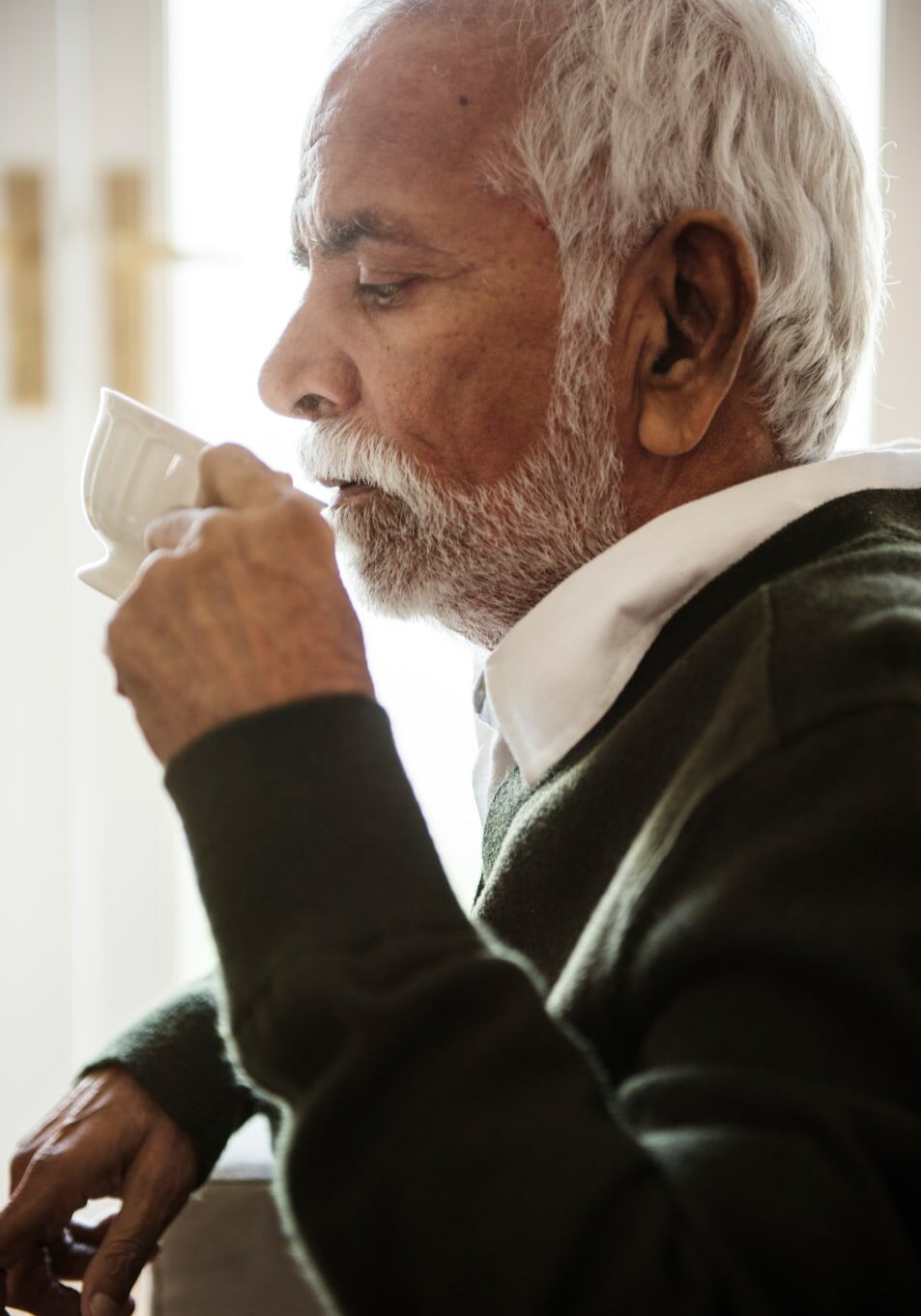 Senior man sipping tea