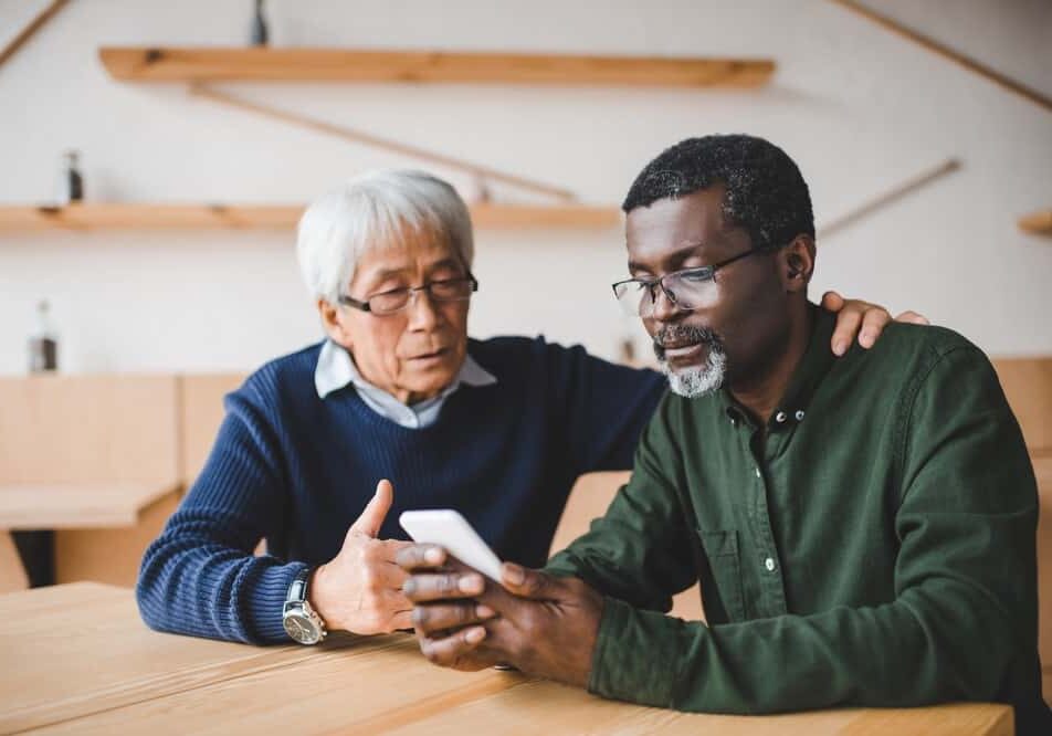 Senior Friends Looking at Phone